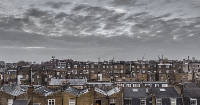Classic rooftops in London with grey sky and clouds