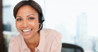 smiling businesswoman in headset