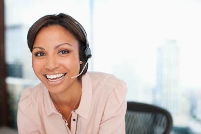 smiling businesswoman in headset