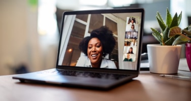 Businesswoman having a video call meeting with her team-272