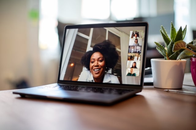 Businesswoman having a video call meeting with her team-272