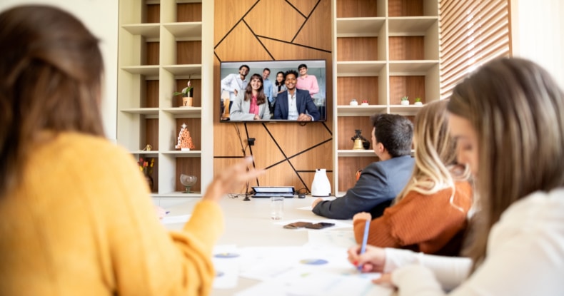 Businesspeople having video conference in an office boardroom-875